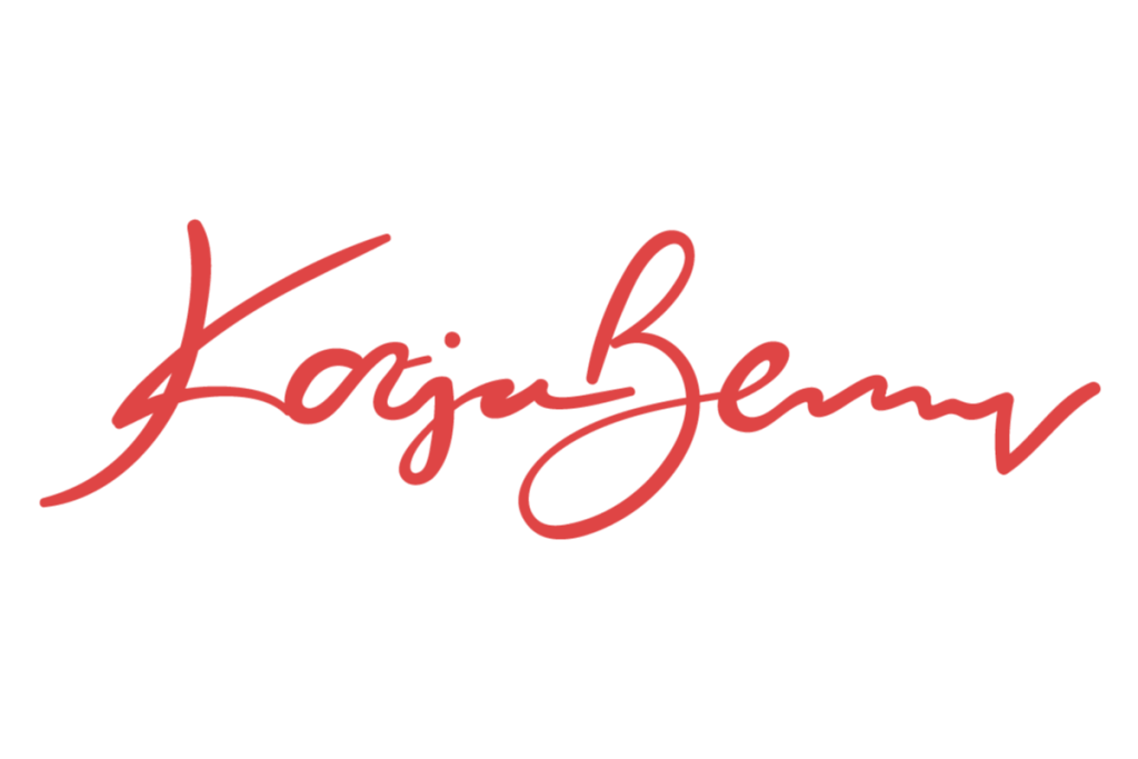 Rote kursive Signatur von Katja Benny auf wei&szlig;em Hintergrund.